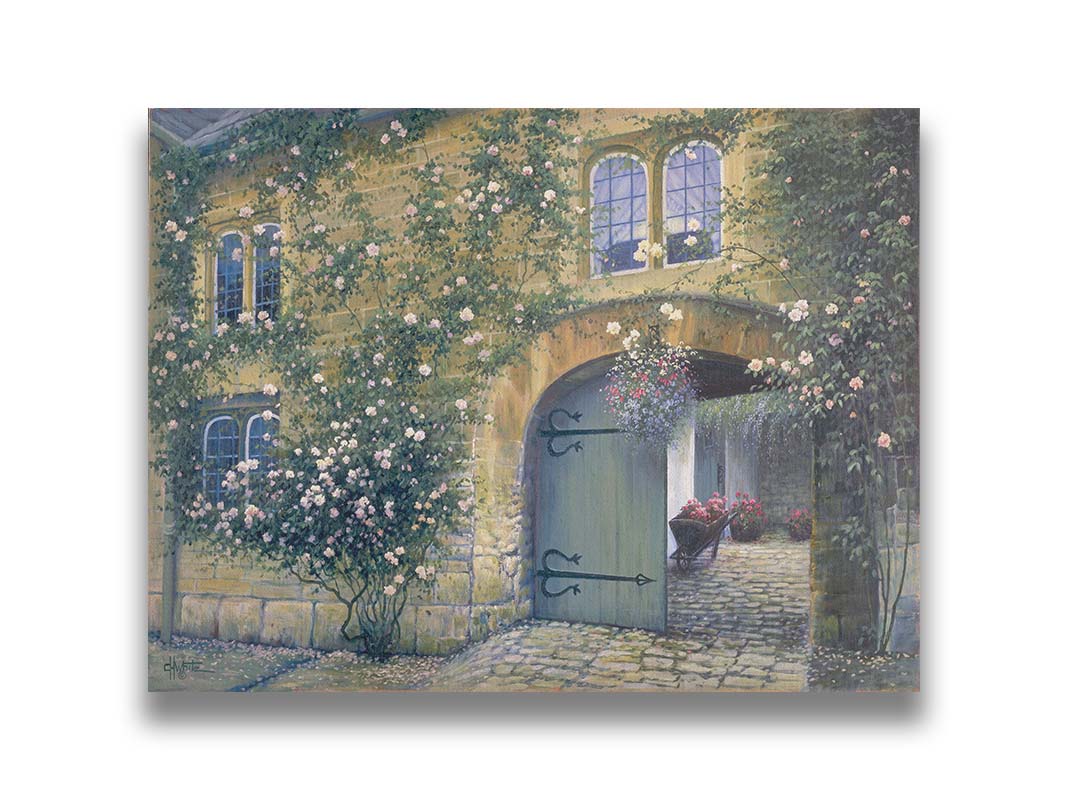 A painting of an arched doorway passing through a building into a courtyard. The building and courtyard are decorated with bushes and vines sprouting an assortment of white and red flowers. Printed on canvas.