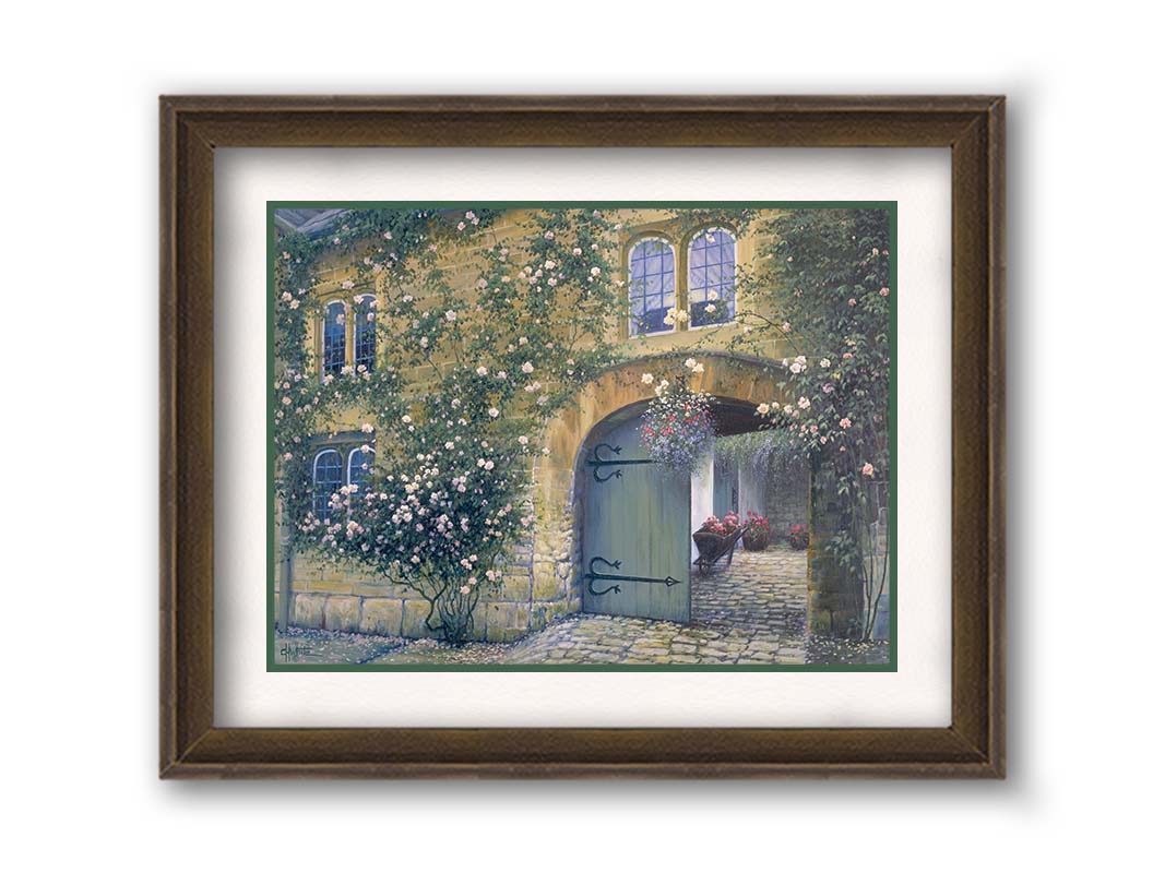 A painting of an arched doorway passing through a building into a courtyard. The building and courtyard are decorated with bushes and vines sprouting an assortment of white and red flowers. Printed on paper, matted, and framed.