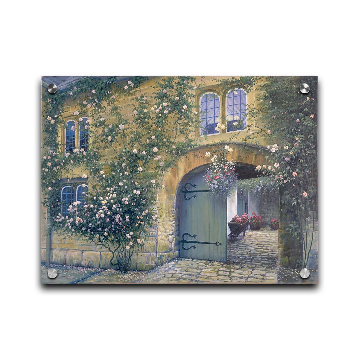 A painting of an arched doorway passing through a building into a courtyard. The building and courtyard are decorated with bushes and vines sprouting an assortment of white and red flowers. Printed on acrylic.