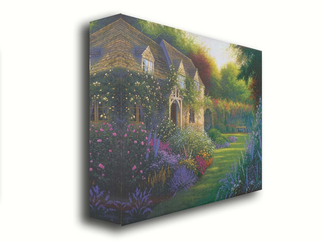 A painting of a blooming garden, with flowers in a variety of pinks, purples, yellows, and whites. A bench site in the grassy clearing beside a cottage, draped in white-flowered vines. Printed on canvas.