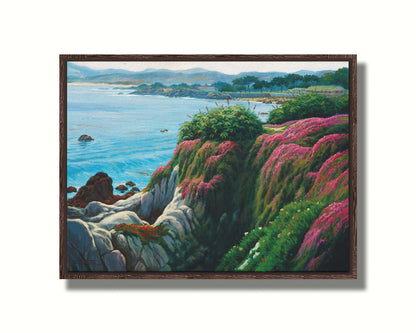 A painting of a clifftop covered in fresh green plants, sprouting pink flowers. Below, the bright blue ocean is calm. Printed on canvas in a float frame.