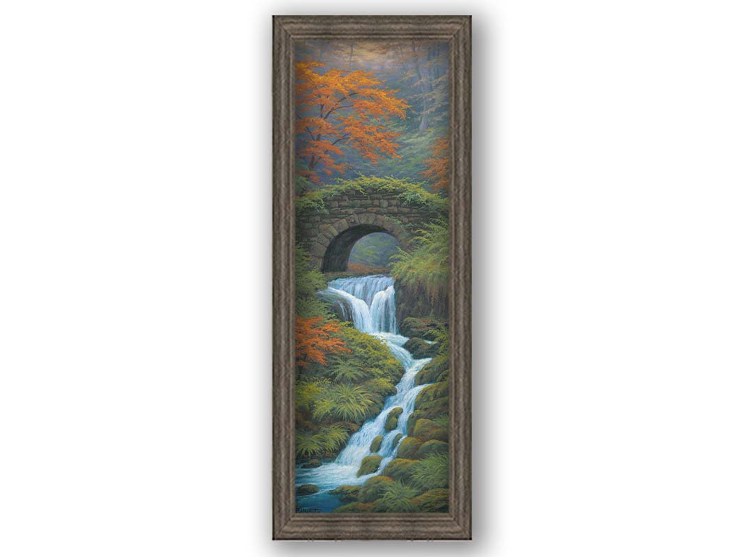 A painting of a creek waterfall, running through a forest. A stone bridge arches over the water. Printed on canvas and framed.