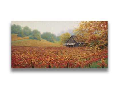 A painting of an old building amidst hills of red, orange, and yellow winery fields Napa Valley is known for. A fog obscures the trees in the distance. Printed on canvas.