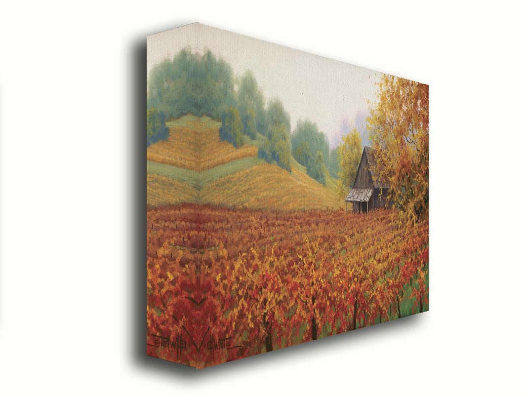 A painting of an old building amidst hills of red, orange, and yellow winery fields Napa Valley is known for. A fog obscures the trees in the distance. Printed on canvas.