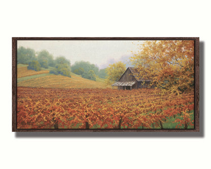 A painting of an old building amidst hills of red, orange, and yellow winery fields Napa Valley is known for. A fog obscures the trees in the distance. Printed on canvas in a float frame.