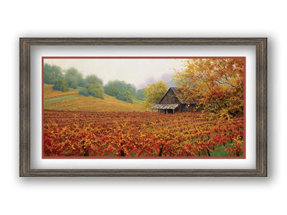 A painting of an old building amidst hills of red, orange, and yellow winery fields Napa Valley is known for. A fog obscures the trees in the distance. Printed on paper, matted, and framed.