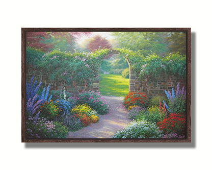 A painting of a stone walled garden with an archway leading to a grassy yard. There are flowers in all colors lining the pathway. Printed on canvas in a float frame.