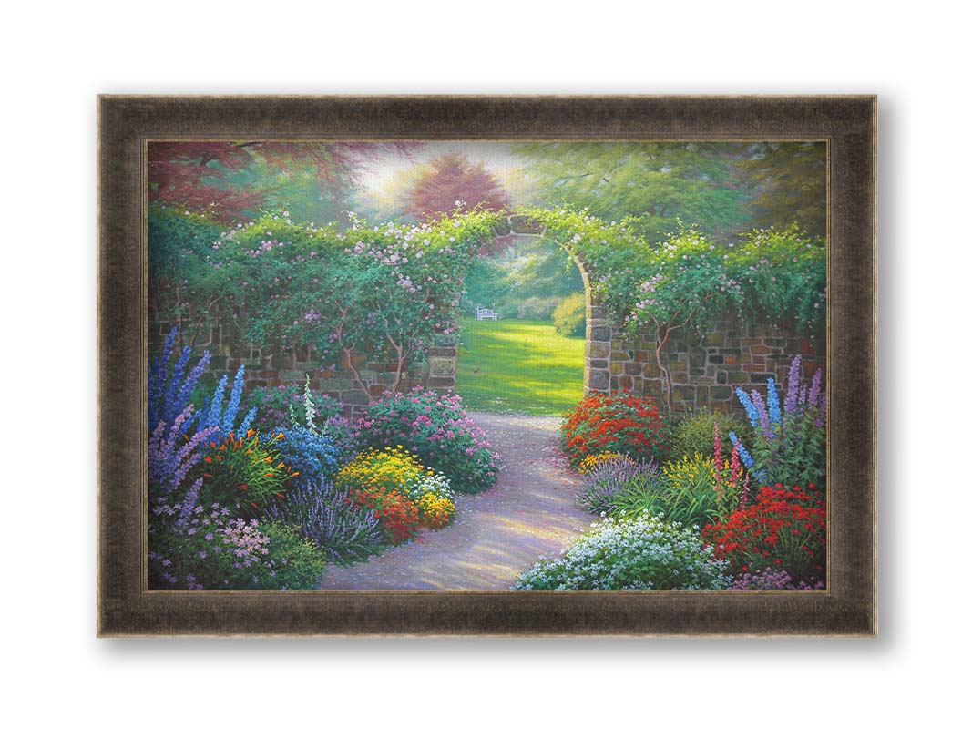 A painting of a stone walled garden with an archway leading to a grassy yard. There are flowers in all colors lining the pathway. Printed on canvas and framed.