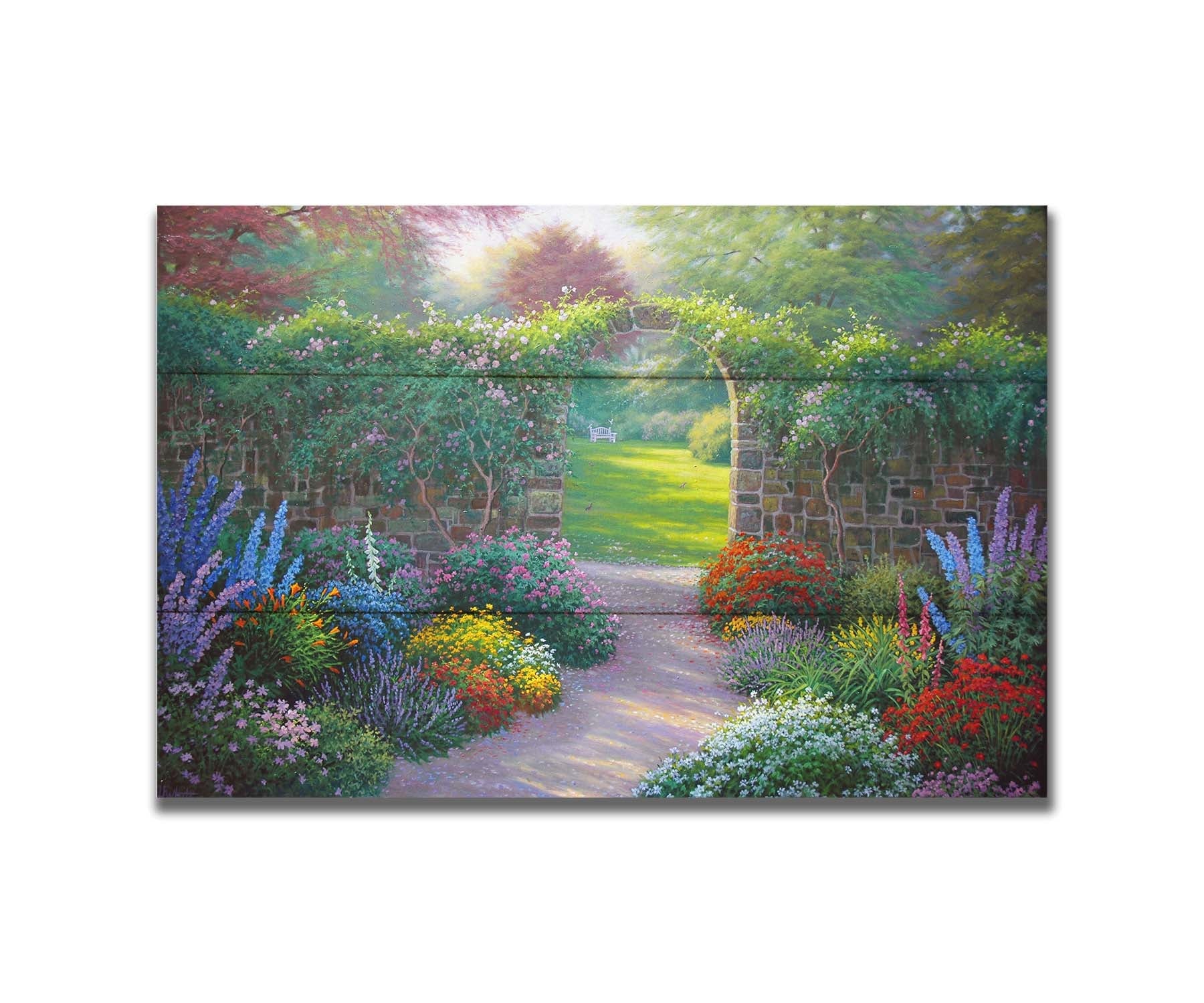 A painting of a stone walled garden with an archway leading to a grassy yard. There are flowers in all colors lining the pathway. Printed on a box board.