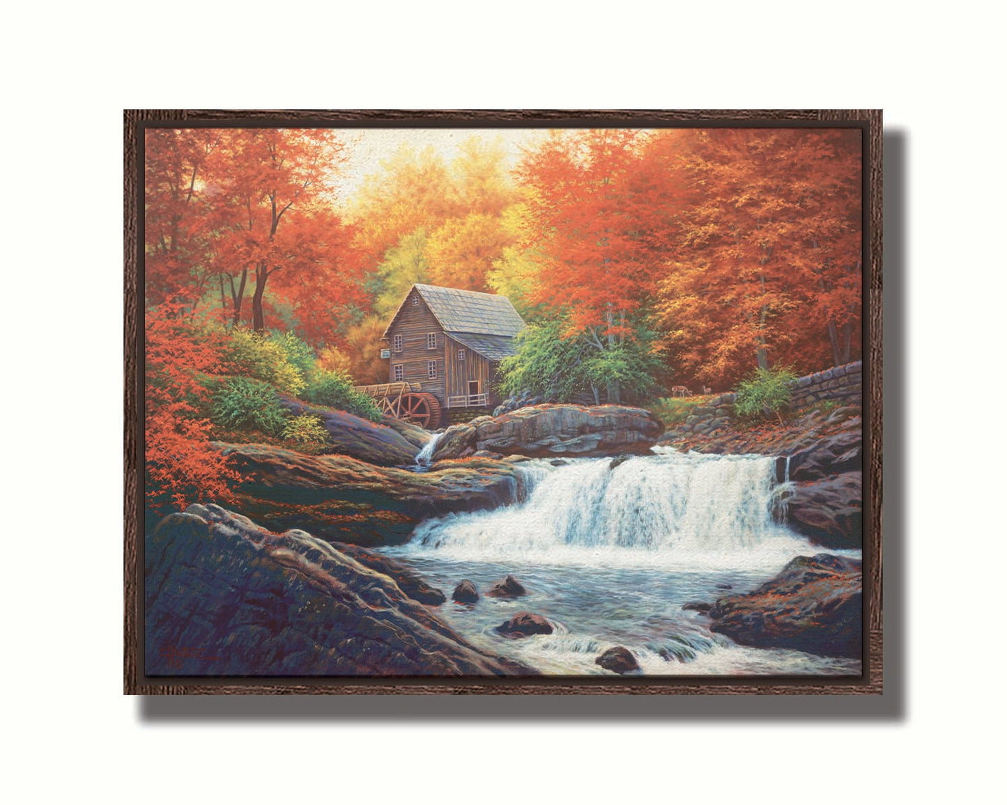 A painting of a stream waterfall in an autumn forest. A watermill can be seen attached to a wood building alone the river. Printed on canvas in a float frame.