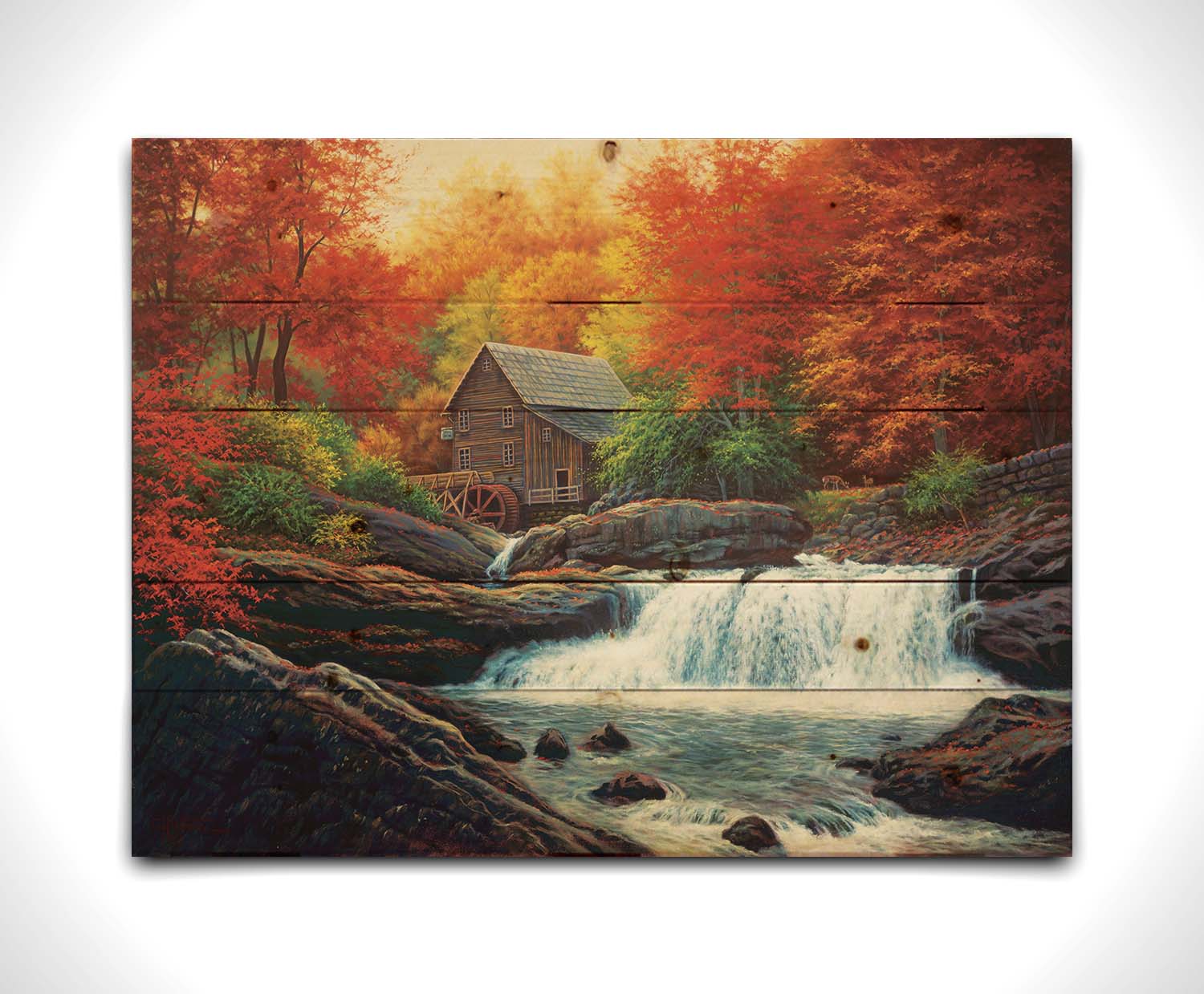 A painting of a stream waterfall in an autumn forest. A watermill can be seen attached to a wood building alone the river. Printed on a wood pallet.