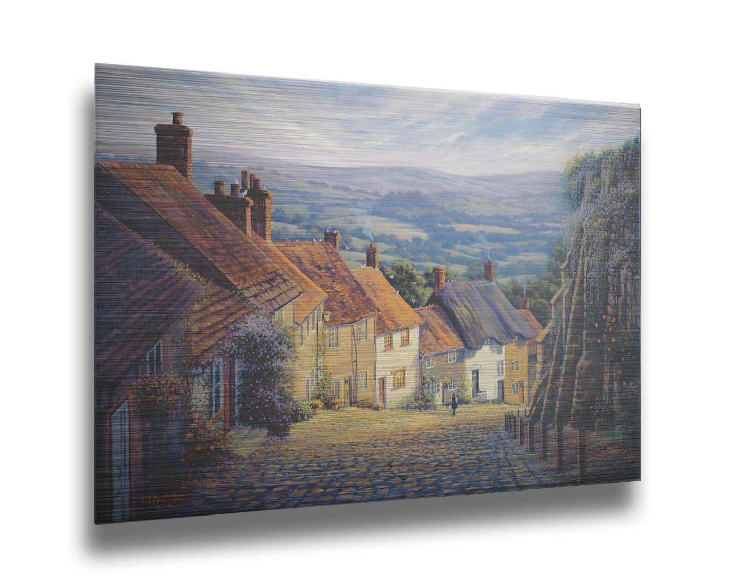 A painting looking down a cobblestone road on a hill lined with houses. A person can be seen walking down the path past flower-laden walls. Printed on metal.