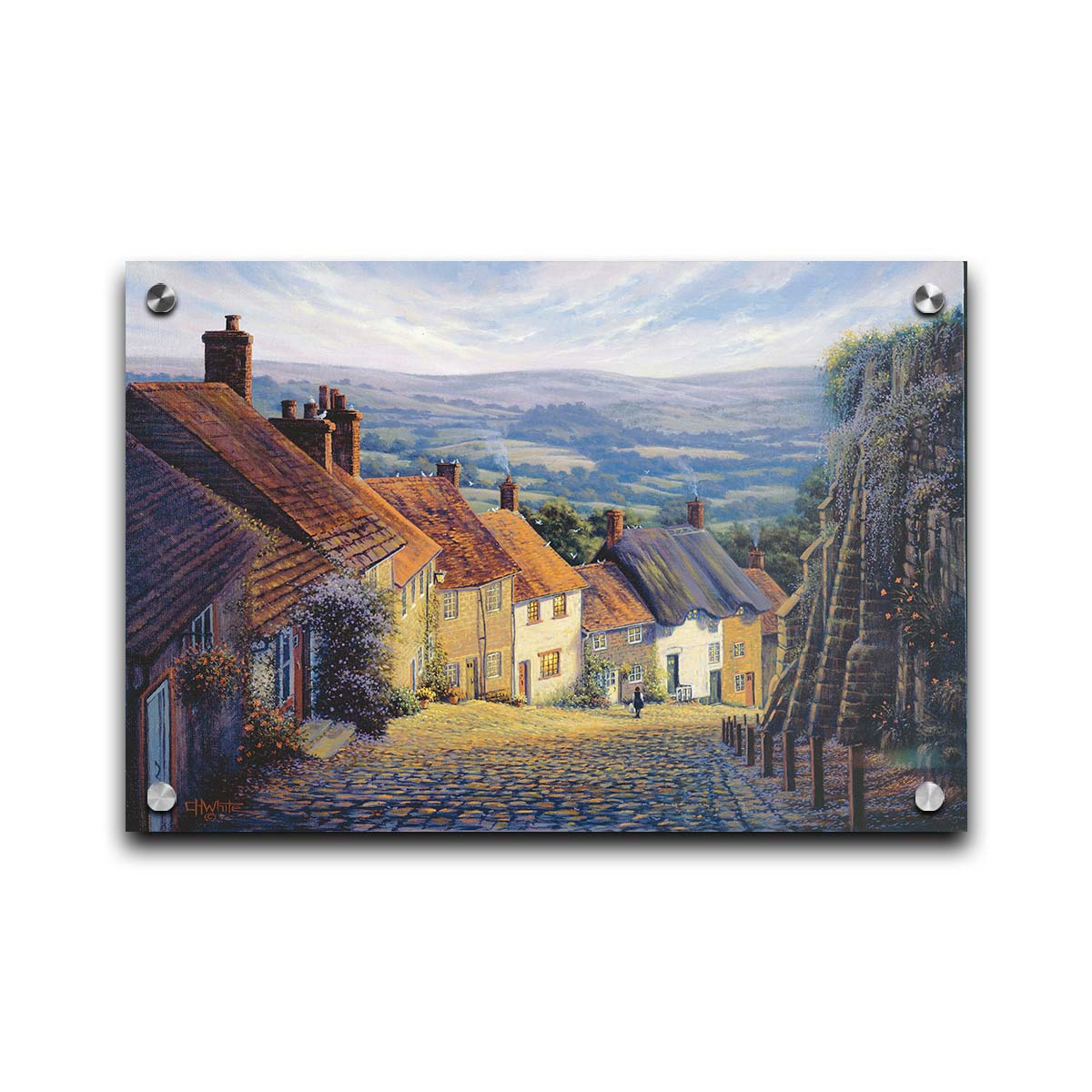 A painting looking down a cobblestone road on a hill lined with houses. A person can be seen walking down the path past flower-laden walls. Printed on acrylic.