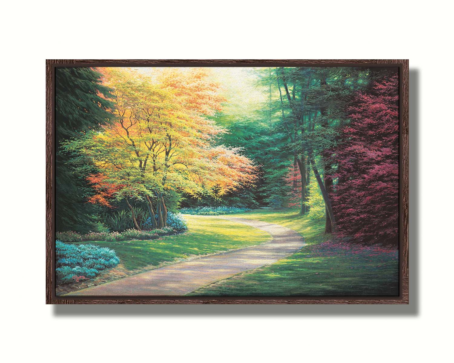 A painting of a landscape with a paved path, lined with lush green, red, and yellow trees and low bushes. Printed on canvas in a float frame.