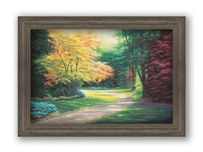 A painting of a landscape with a paved path, lined with lush green, red, and yellow trees and low bushes. Printed on canvas and framed.