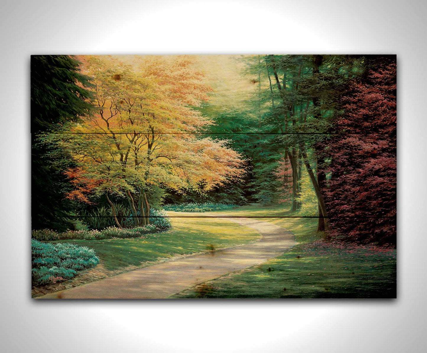 A painting of a landscape with a paved path, lined with lush green, red, and yellow trees and low bushes. Printed on a wood pallet.