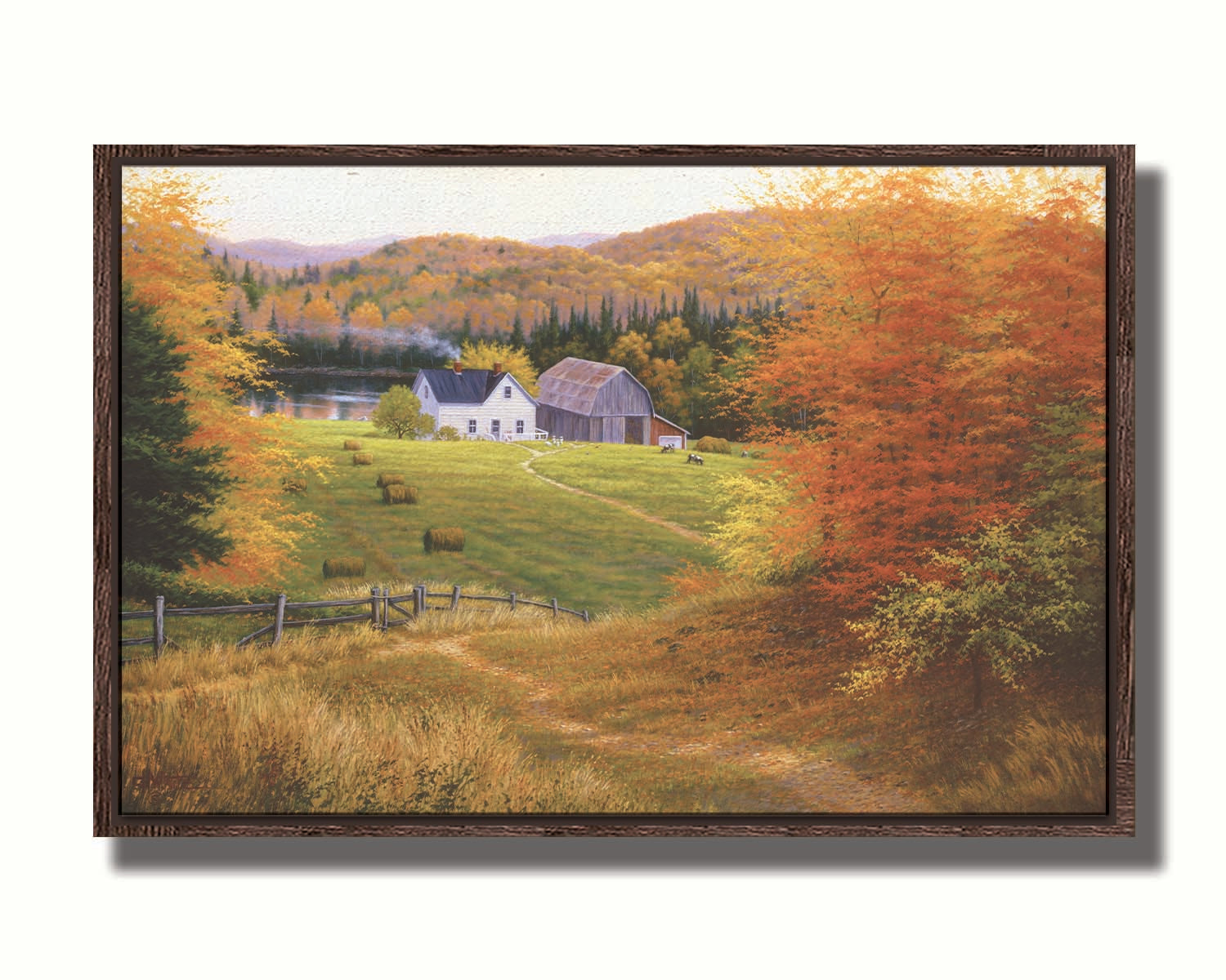 A painting of a view looking down on a lakeside home and barn from a forest, featuring a few farm animals and hay bales. Printed on canvas in a float frame.