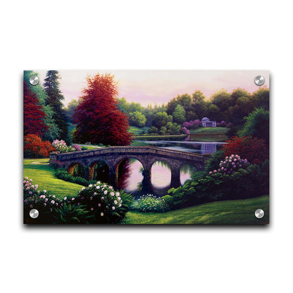 A landscape painting of a lake scene. A stone bridge in the foreground is surrounded by bushes of pink and red flowers, as well as green and red trees. Printed on acrylic.