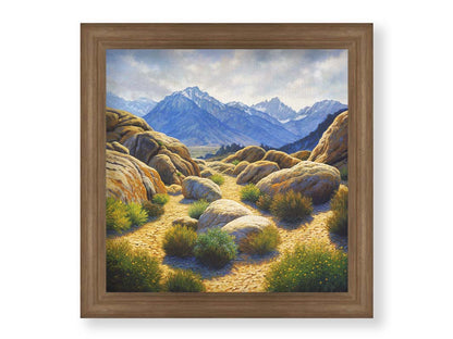 A landscape painting of Mount Whitney as seen from Lone Pine Lake, California. The highly detailed environment of tan stones directs the view to the distant mountains, tinted blue by the atmosphere. Printed on canvas and framed.