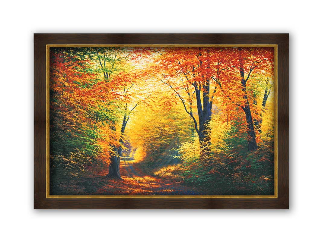 A painting of a path through an autumn forest, with sunlight highlighting the golden yellow and orange leaves of the trees. Printed on canvas and framed.