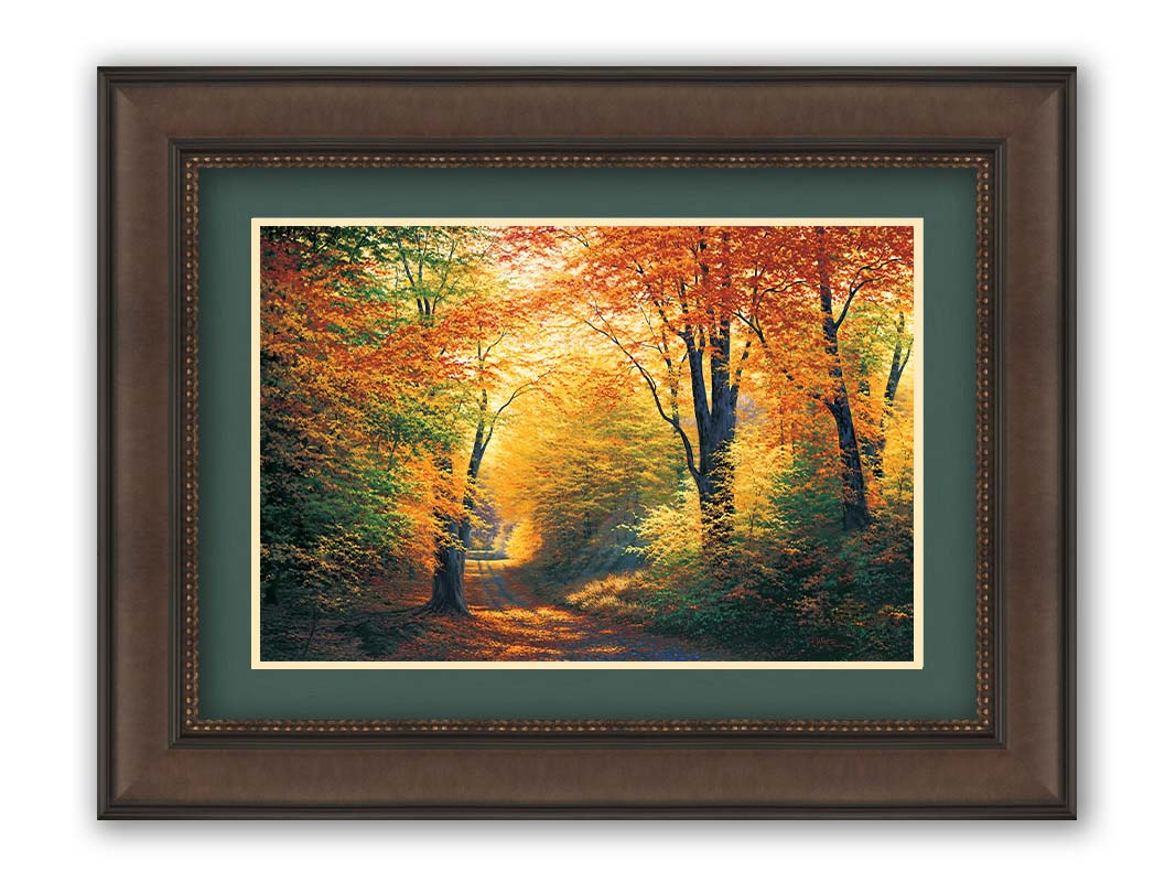 A painting of a path through an autumn forest, with sunlight highlighting the golden yellow and orange leaves of the trees. Printed on paper, matted, and framed.