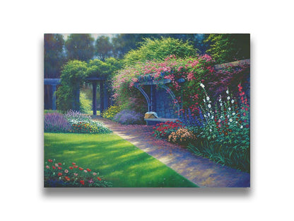 A painting of the Hatley Park Garden at Royal Roads University, overlooking a path surrouded by flowering plants. A bench with a picnic basket sits on the path against a stone wall. Printed on canvas.