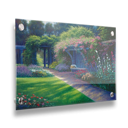 A painting of the Hatley Park Garden at Royal Roads University, overlooking a path surrouded by flowering plants. A bench with a picnic basket sits on the path against a stone wall. Printed on acrylic.