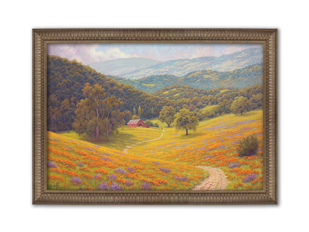 A painting of a grassy field of poppies and lupines on a hilly landscape. A path leads down to a red barn at the edge of a forest. Printed on canvas and framed.