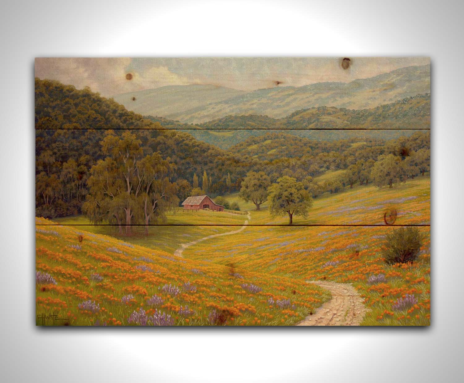 A painting of a grassy field of poppies and lupines on a hilly landscape. A path leads down to a red barn at the edge of a forest. Printed on a wood pallet.