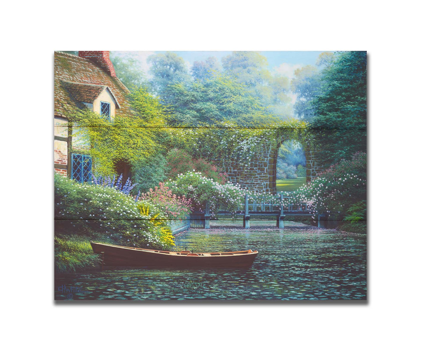 A painting of a canoe docked in a river covered in lily pads. A flower-covered bridge crosses the river, leading to a house coated in vines. A stone arched wall leads to another section of the garden in the background. Printed on a box board.