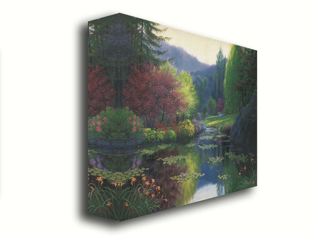 A painting of a large open garden. A pond growing lily pads fills the foreground. Bushes growing flowers in every color line the pond. A white bench sits in a grassy clearing in the background. Printed on canvas.