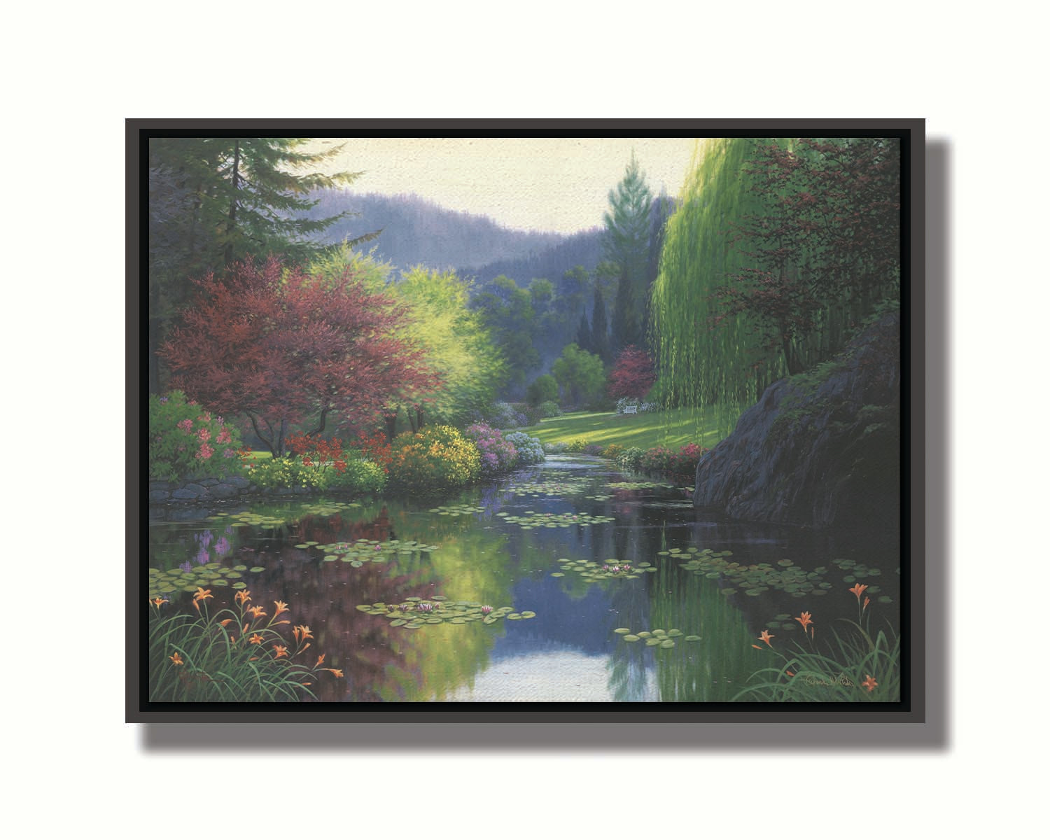 A painting of a large open garden. A pond growing lily pads fills the foreground. Bushes growing flowers in every color line the pond. A white bench sits in a grassy clearing in the background. Printed on canvas in a float frame.