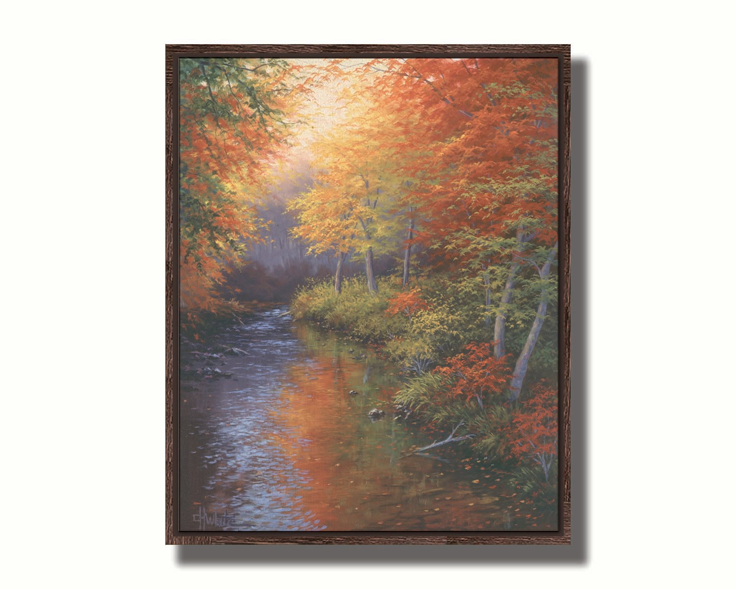 A painting of a forest reflecting off a stream, created using a pallet of warm fall tones. The shedding red and orange leaves land and are carried away by the water below. Printed on canvas in a float frame.