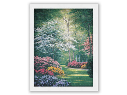 A painting of a vibrant garden, featuring a white gazebo. Flowering shrubs in an array of colors line the grassy path. Printed on canvas and framed.