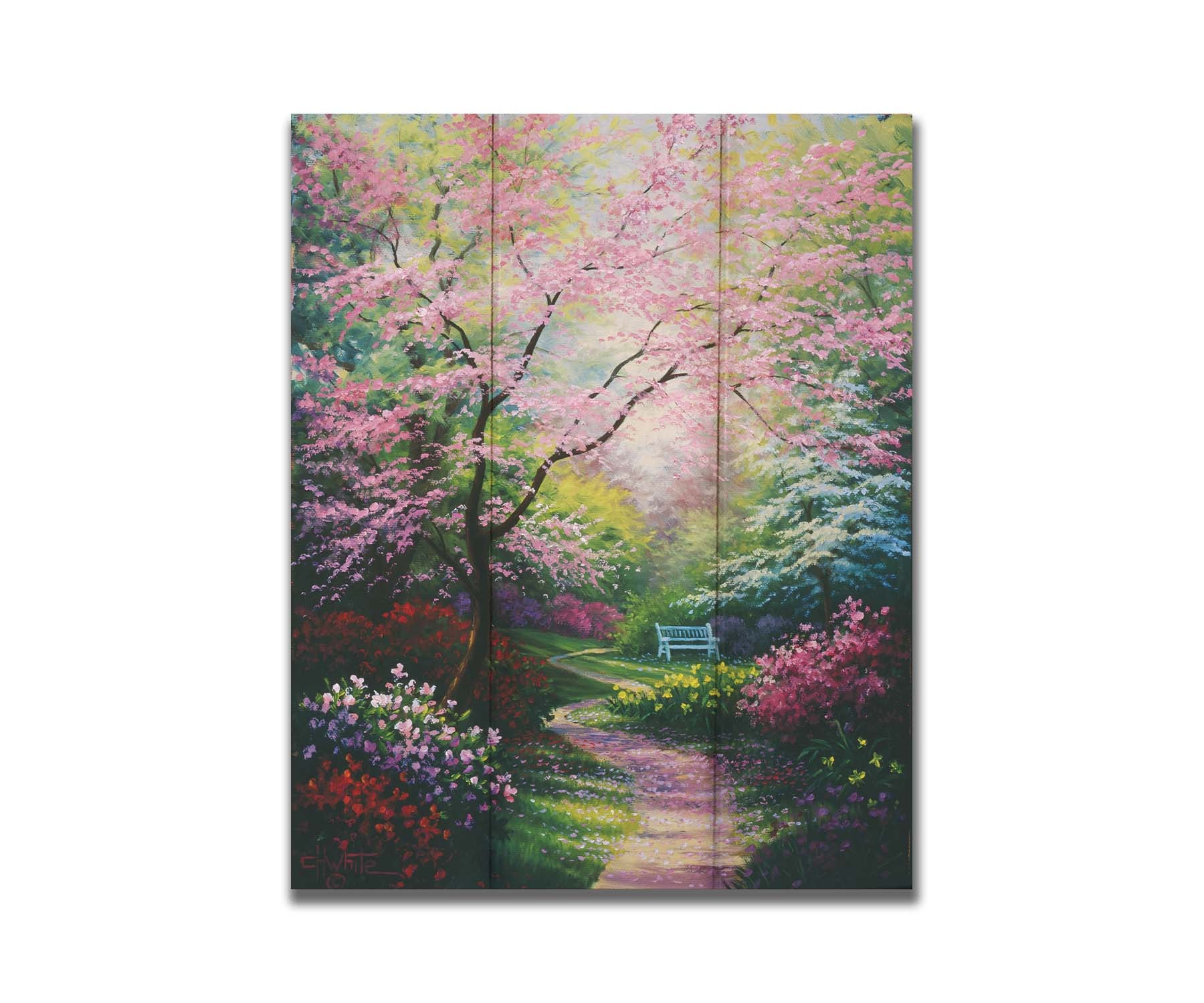 A painting of a garden in spring, with pink, red, and white blossoms on the bushes and trees. Pink petals fall from a tree by the narrow path, piling on the ground. A park bench can be seen in the distance. Printed on a box board.