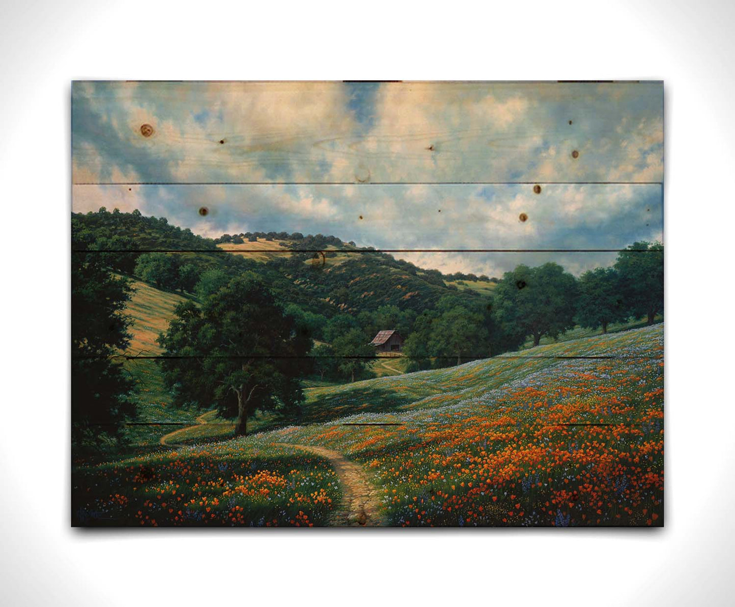 A painting of a hillside meadow of orange and blue flowers. A thin dirt path cuts through the meadow, leading to an old barn in the distance. Printed on a wood pallet.