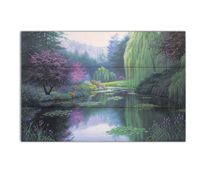 A painting of a tranquil lake, reflecting the greens, pinks, purples, and blues of the spring plant growth. Printed on a box board.