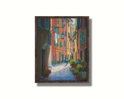 A painting of a stone path through Portofino, Italy. Warm-colored building line the road, clothes hanging from their window lines. Potted flowers grow at the doorsteps. Printed on canvas in a float frame.