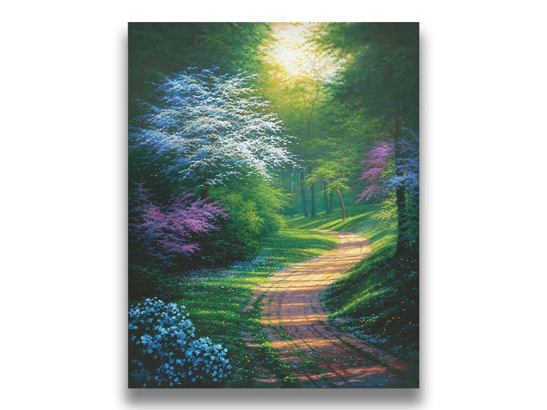 A painting of a dirt path through a wooded area during spring. Trees lining the road bloom in pink and white. Small yellow flowers dot the grass around the path. Printed on canvas.