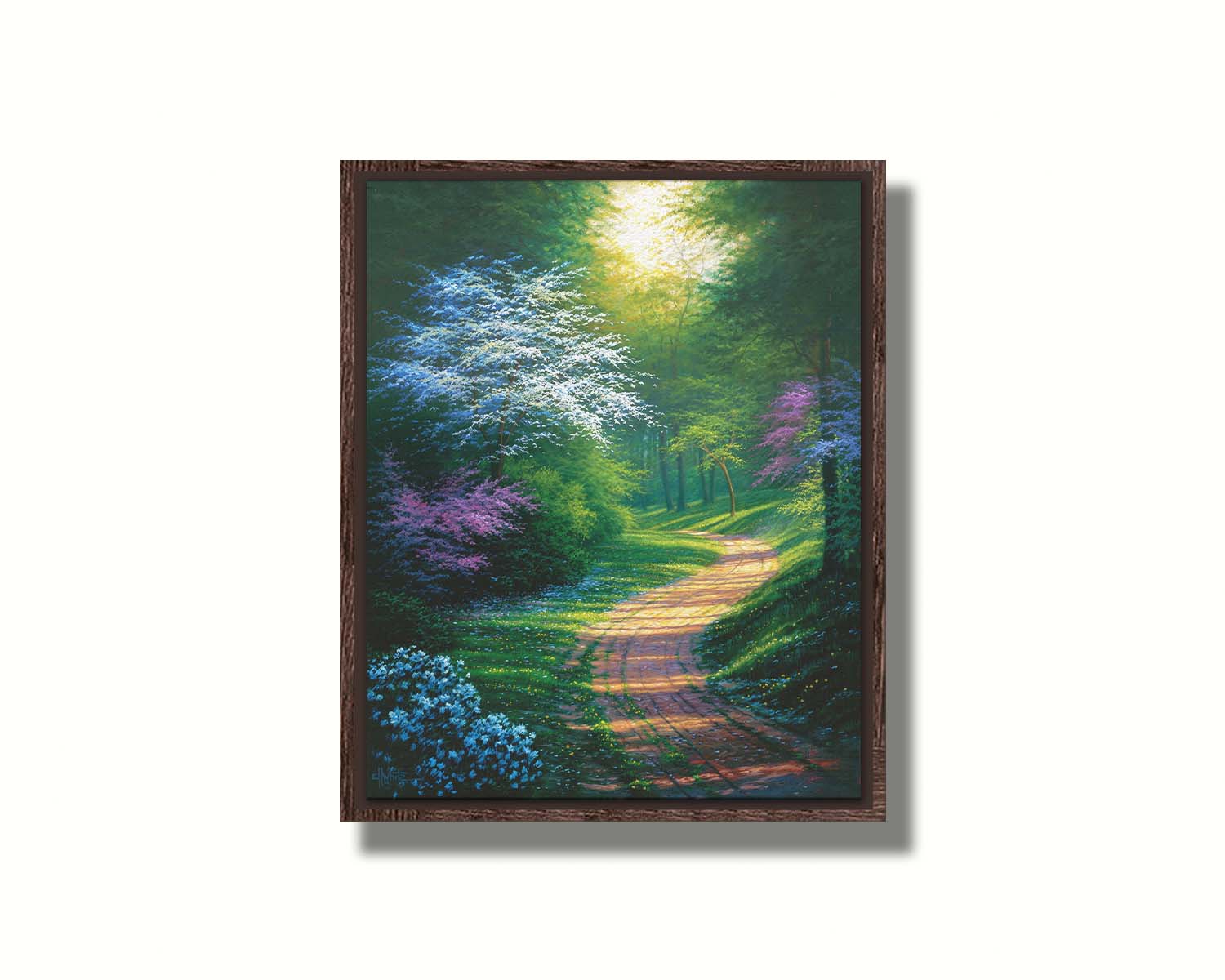 A painting of a dirt path through a wooded area during spring. Trees lining the road bloom in pink and white. Small yellow flowers dot the grass around the path. Printed on canvas in a float frame.