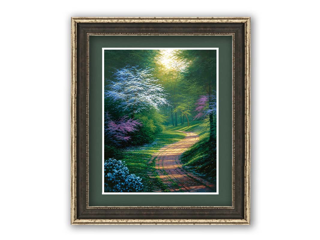 A painting of a dirt path through a wooded area during spring. Trees lining the road bloom in pink and white. Small yellow flowers dot the grass around the path. Printed on paper, matted, and framed.