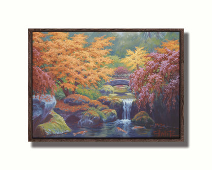 A painting of a garden with red, orange, and green trees. A stone bridge crosses a stream, which runs as a waterfalli into a pond of koi carp. Printed on canvas in a float frame.