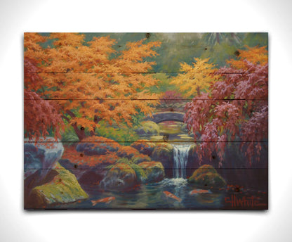 A painting of a garden with red, orange, and green trees. A stone bridge crosses a stream, which runs as a waterfalli into a pond of koi carp. Printed on a wood pallet.