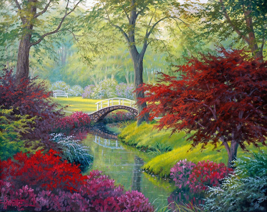 A painting of a garden park, with a stone bridge crossing a stream surrounded by flowering plants. Red, pink, and white flowers stand out against the vibrant greens of the grasses and trees. A white bench can be seen in a grassy clearing in the distance.