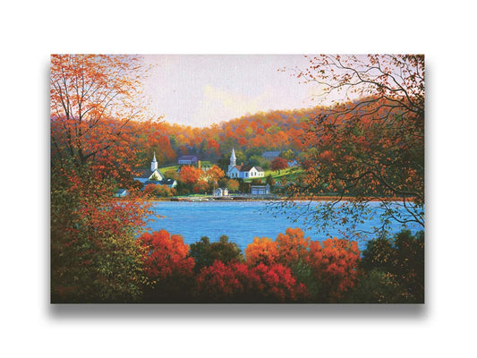 A painting of a small lakeside town, surrounded by an autumn forest. Orange and red leaves contrast green grass and vibrant blue water. Printed on canvas.