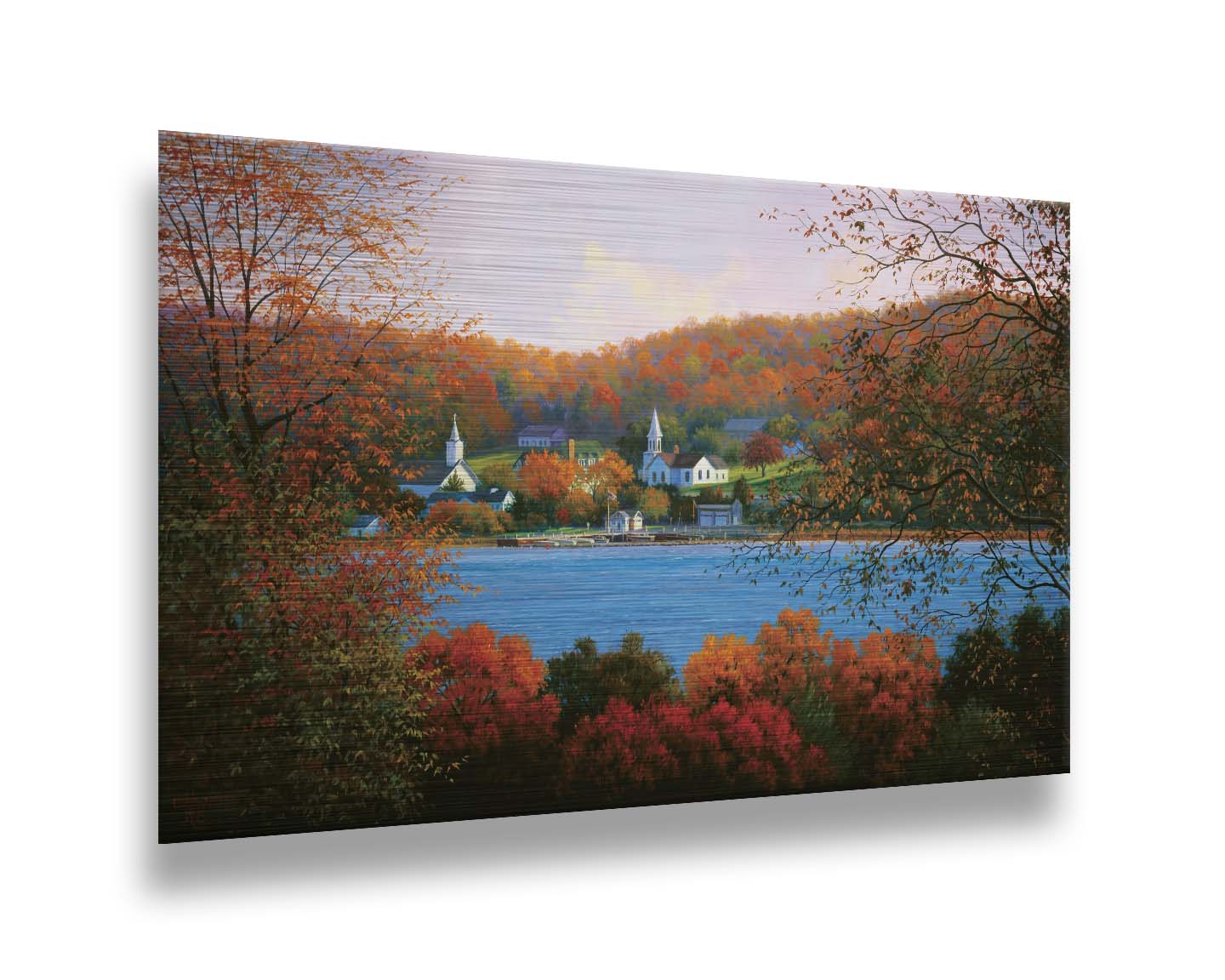 A painting of a small lakeside town, surrounded by an autumn forest. Orange and red leaves contrast green grass and vibrant blue water. Printed on metal.