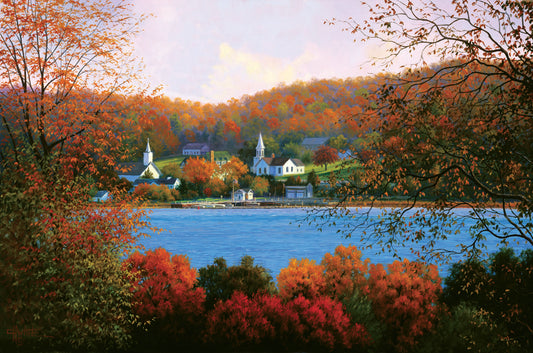 A painting of a small lakeside town, surrounded by an autumn forest. Orange and red leaves contrast green grass and vibrant blue water.