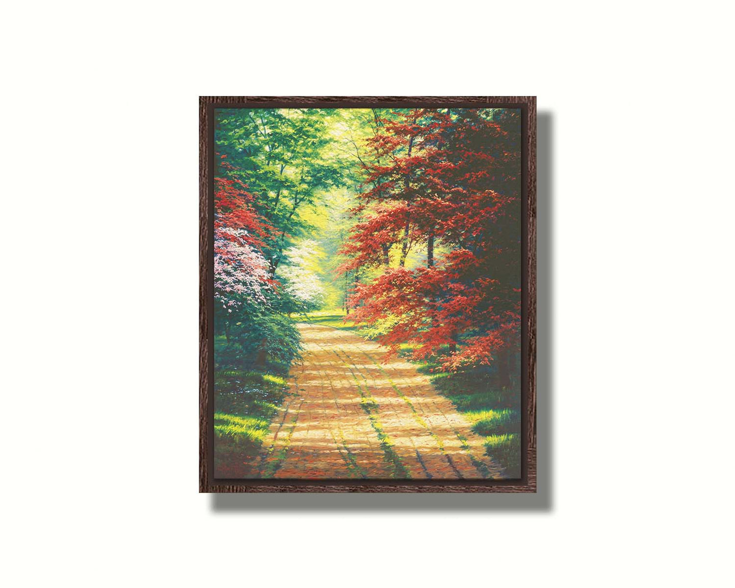 A painting of a dirt path through a spring woodland. Vibrant green trees grow alongside red japanese maples and pink and white blossoms. Printed on canvas in a float frame.