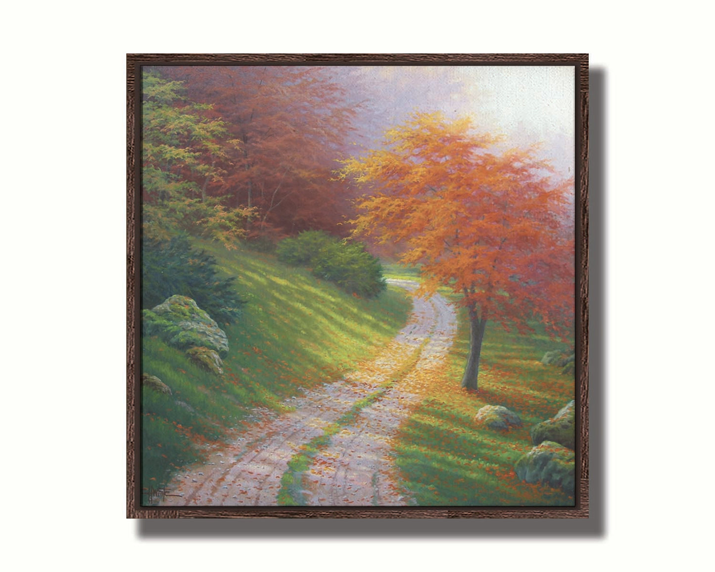 A painting of a gravel road winding around a hill between autumn trees. Printed on canvas in a float frame.