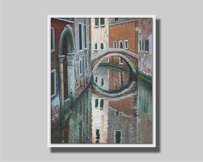 A painting of a Venice canal alleyway, passing under a bridge between old brick buildings. Printed on canvas in a float frame.